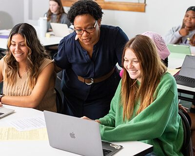 Professor helping a Social Work student in class