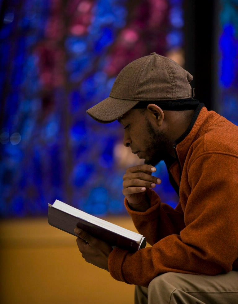A graduate student in biblical studies reading a book