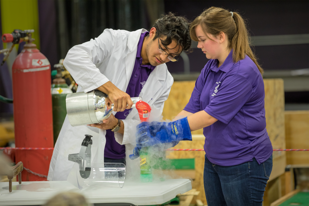 Two ACU engineering students doing science experiments
