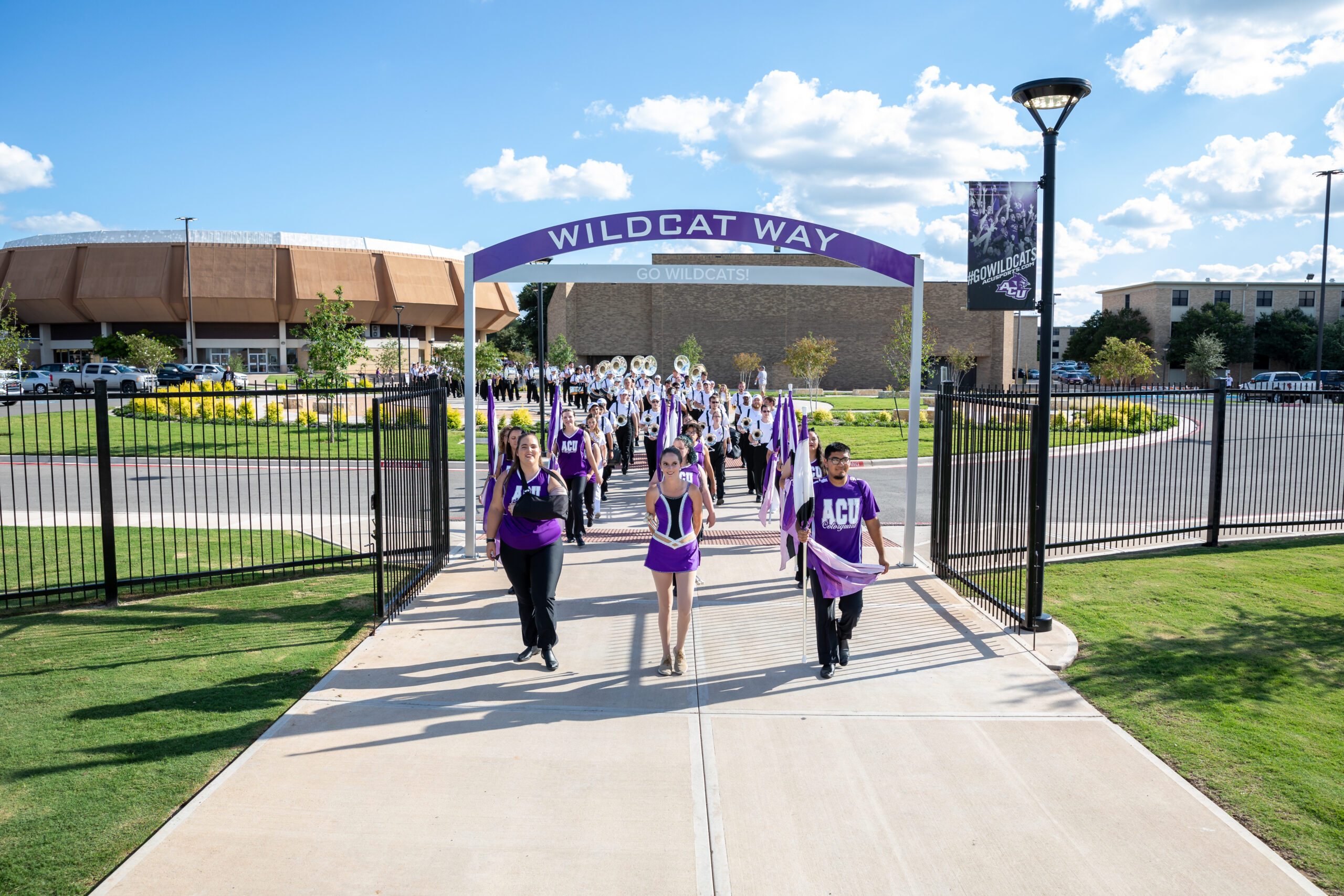 A group of students walking through the “Wildcat Way”