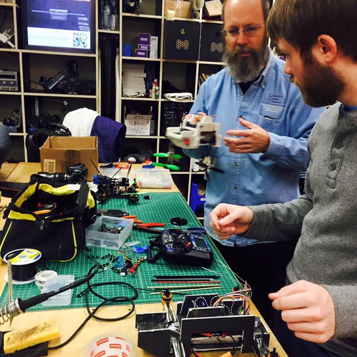 two men working in Abilene Christian University's maker lab