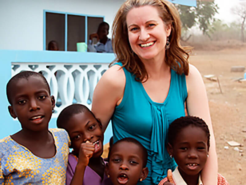 Kara Ulmer ('98) with kids in another country