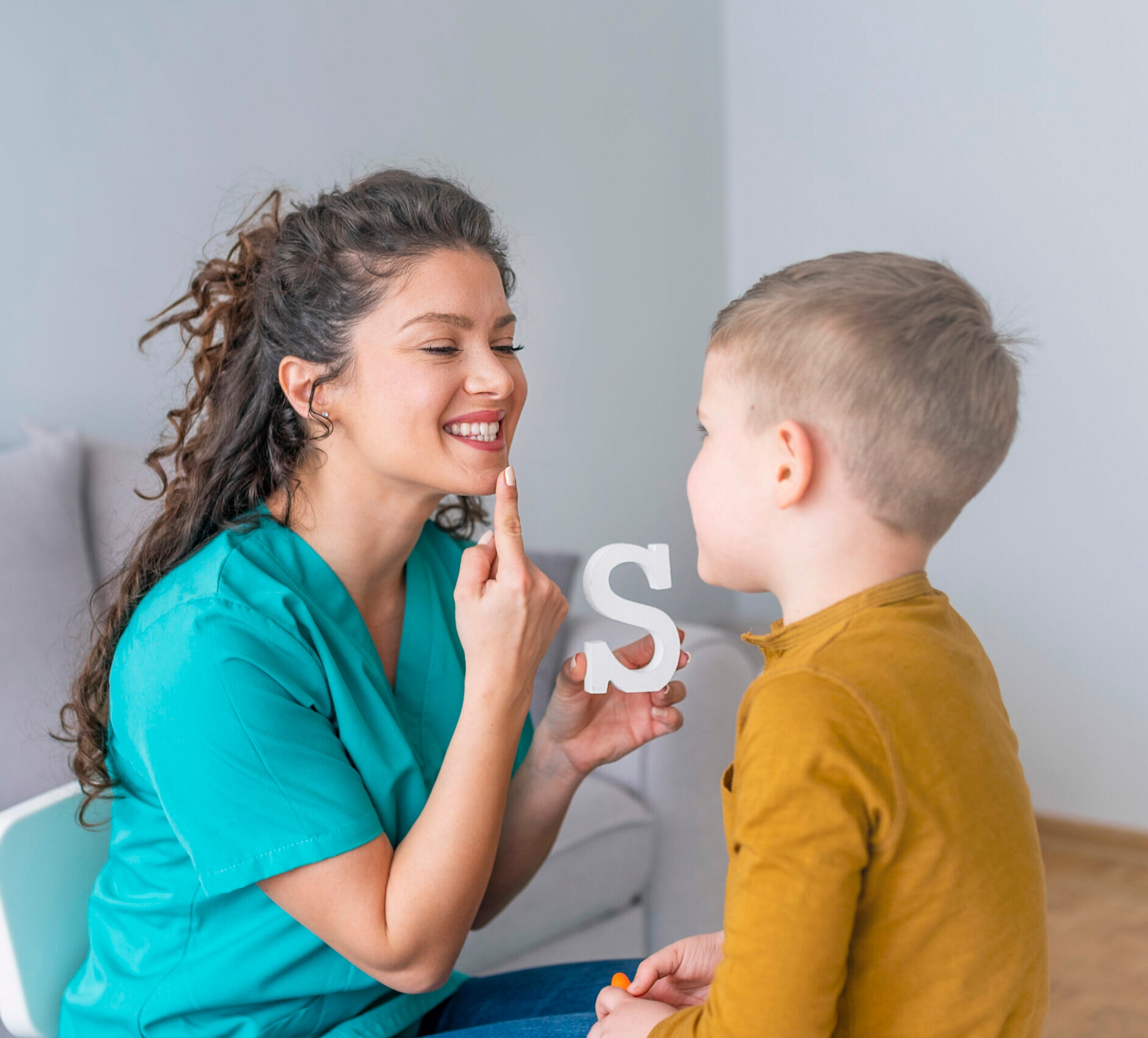 Speech therapist works with young child