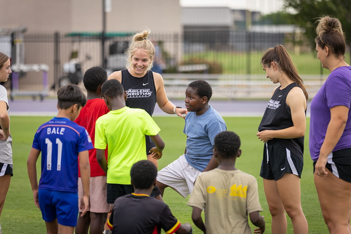 Members of the ACU women’s soccer team work with local refugee children at the Play4More Soccer Camp, a project started by Drs. Heidi and Jason Morris, who both serve on the Abilene Christian University faculty..