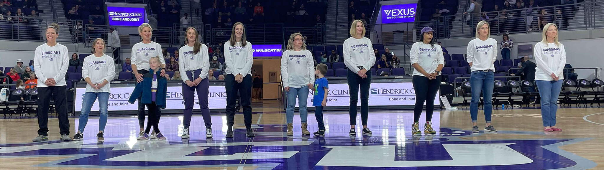 Participants in Wildcat Mentors were recognized at a recent game. From left are Brenda Andress, Jennifer Hogan, Allison Coil, Millie Goetz, Micky Brewer, Calli Cannon, Caren Christian, Andrea Jackson, Kendra Whitehead and Jennifer Johnson-Fernandez.