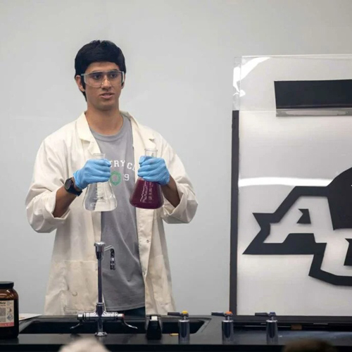 ACU chemistry student giving a lab demonstration