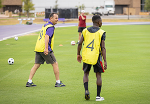 Dr. Jason Morris, left, at the Play4More soccer camp