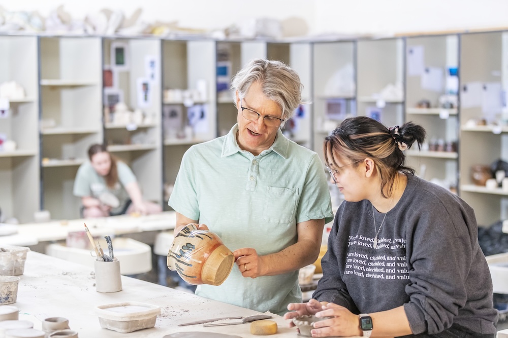 art faculty with student.