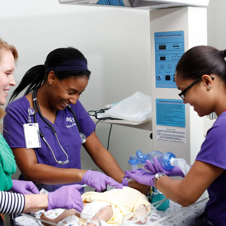 ACU Nursing students learn to give oxygen to a newborn infant