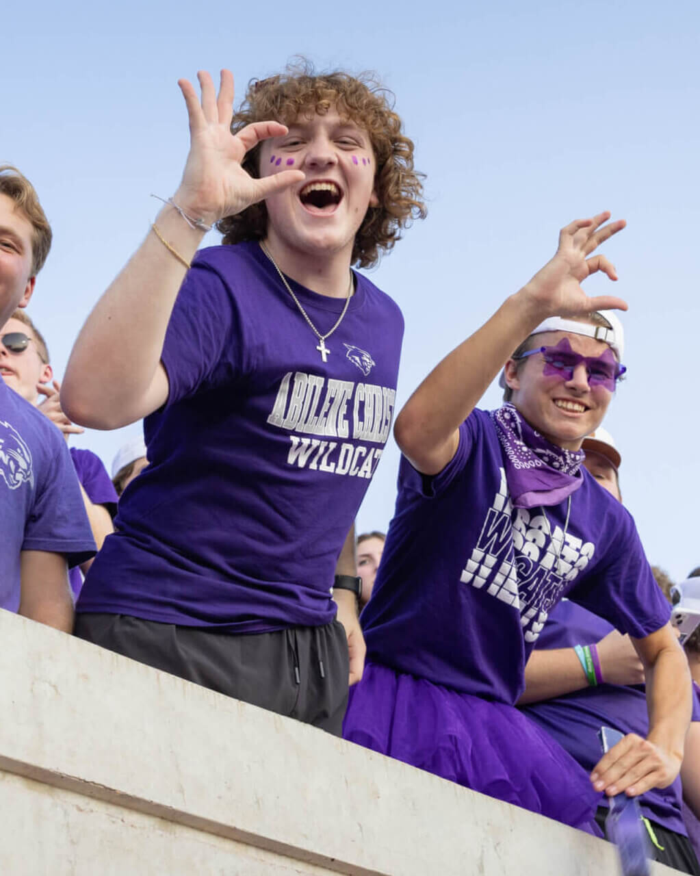 Students cheering at a football game