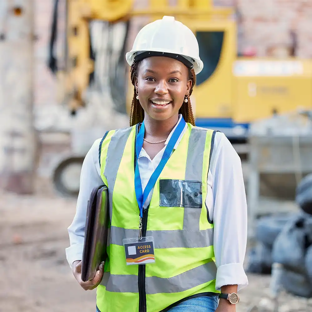 Young construction manager oversees a construction site.