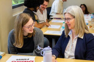 Student talking with faculty member