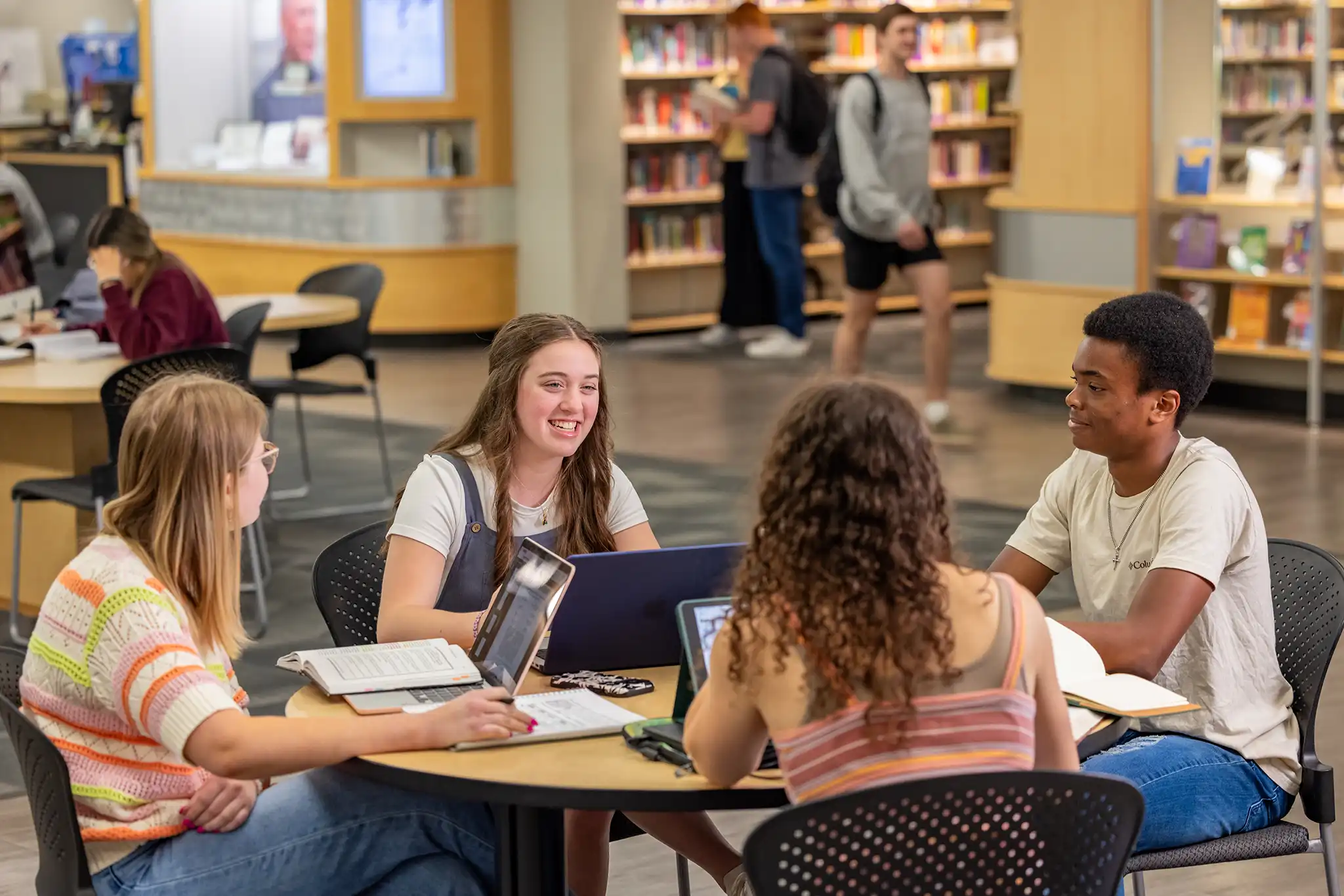 Students work on a project together in ACU's library.