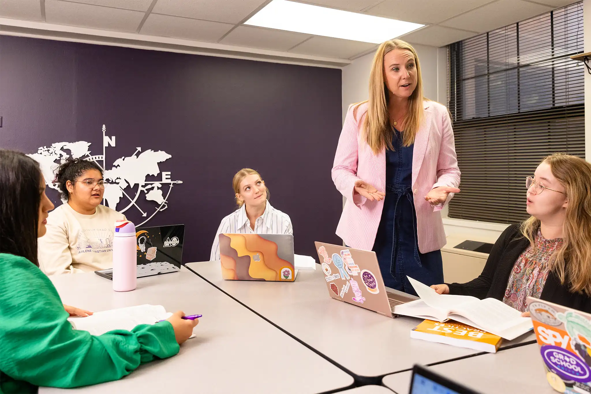 A roundtable discussion with graduate students and a professor.