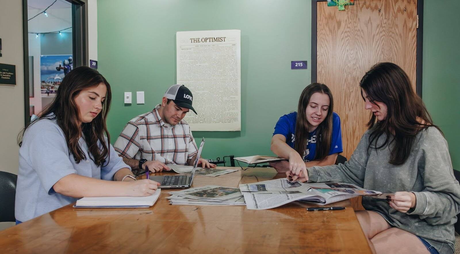 students working together in the ACU Optimist.