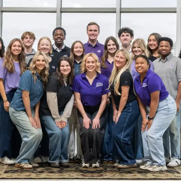 ACU's tour guides pose for a group photo.