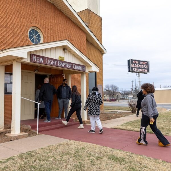 Students, faculty, staff walk into New Light Baptist Church