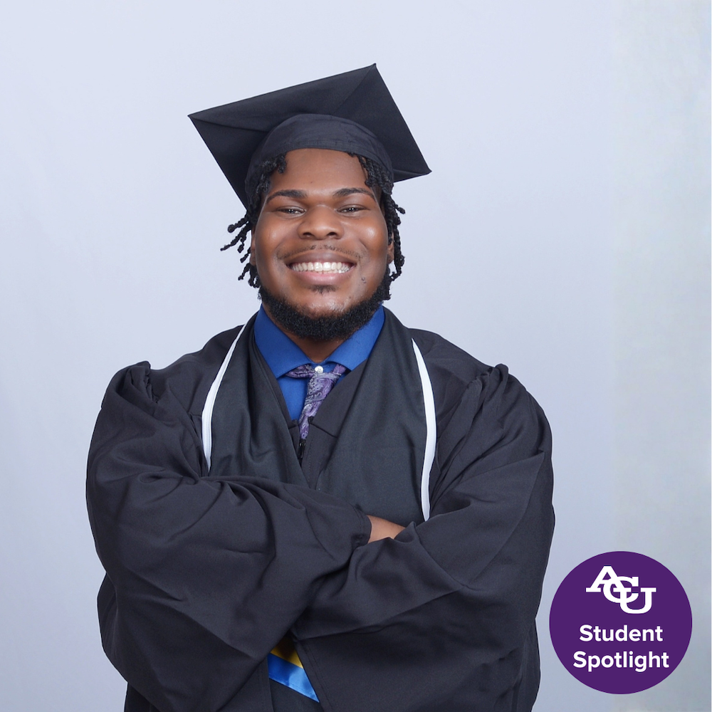 Tyler Stanley smiling in cap and gown.
