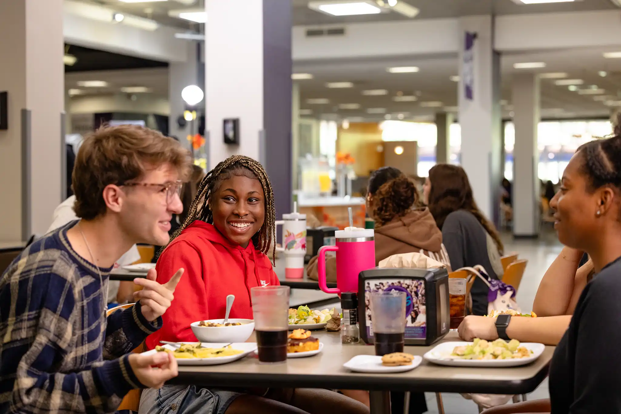 Students chat during lunch in the World Famous Bean.