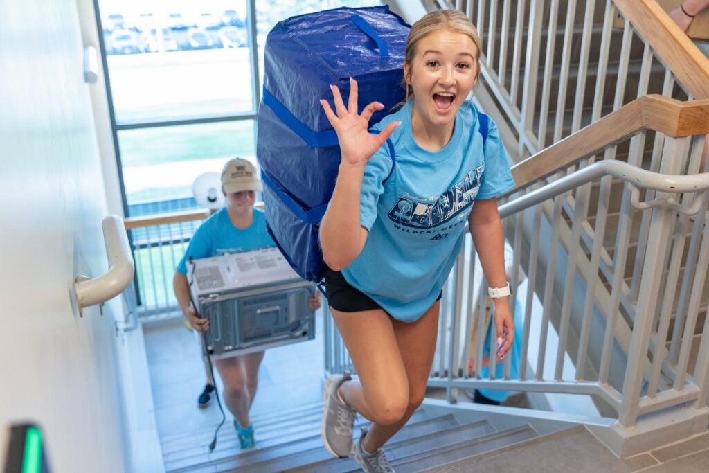 student walking upstairs giving the WC.