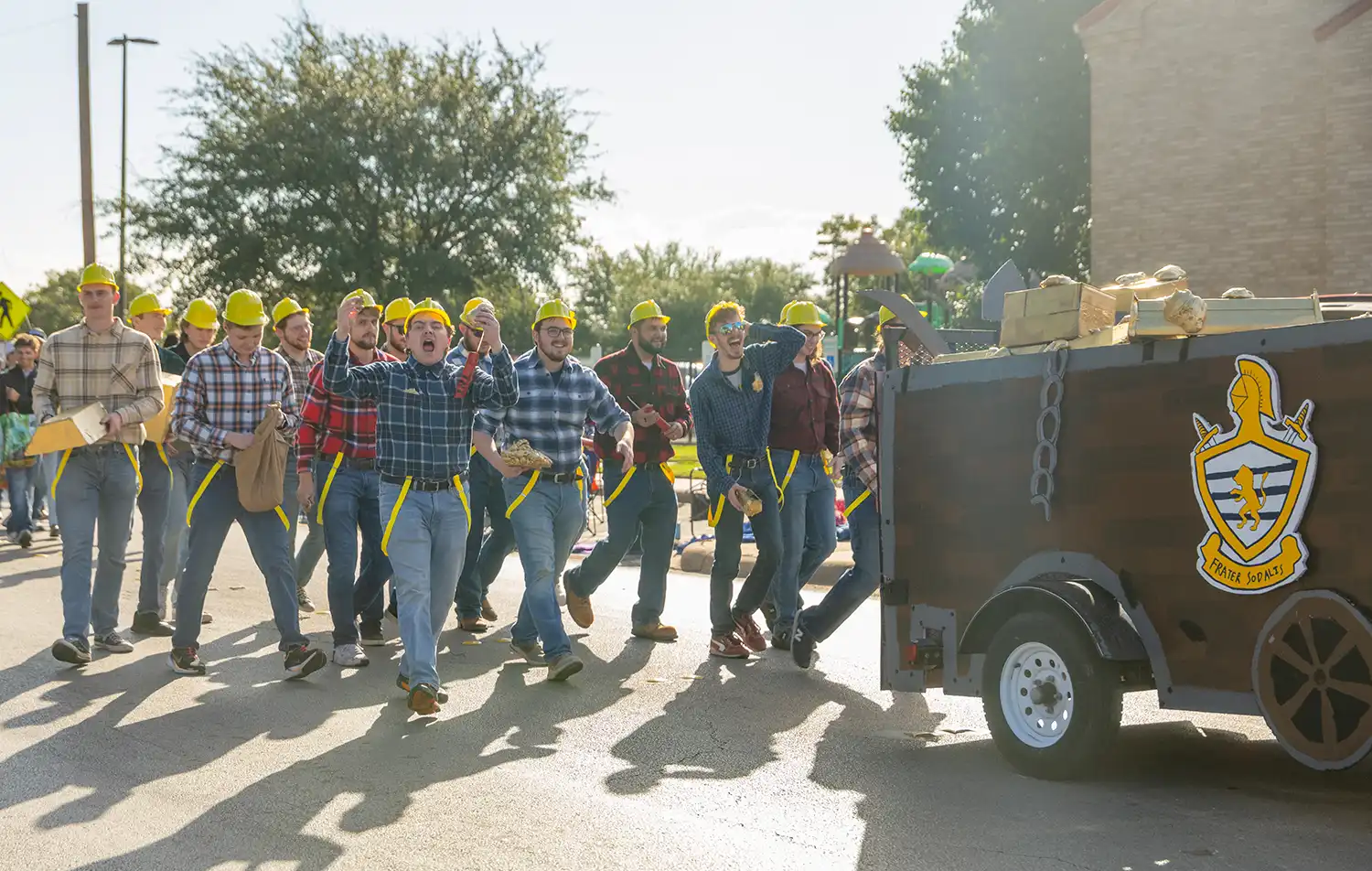 The Frater Sodalis Homecoming parade float with members as gold miners.