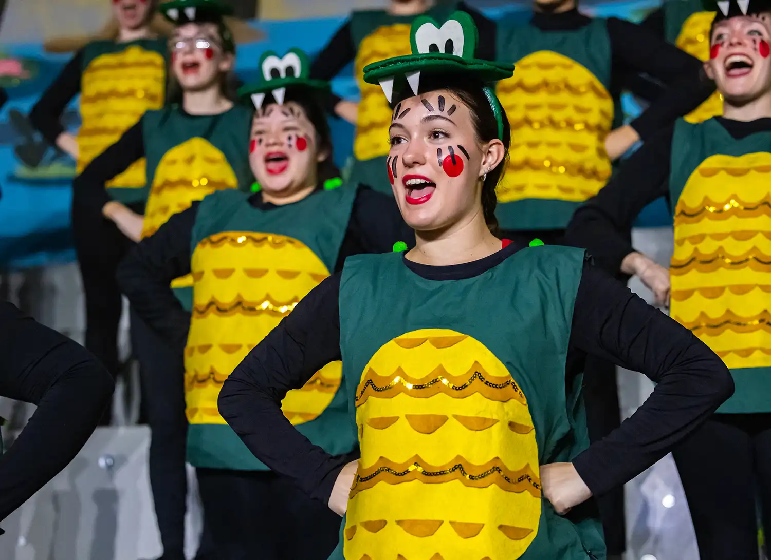 GATA performs in alligator costumes at Sing Song.