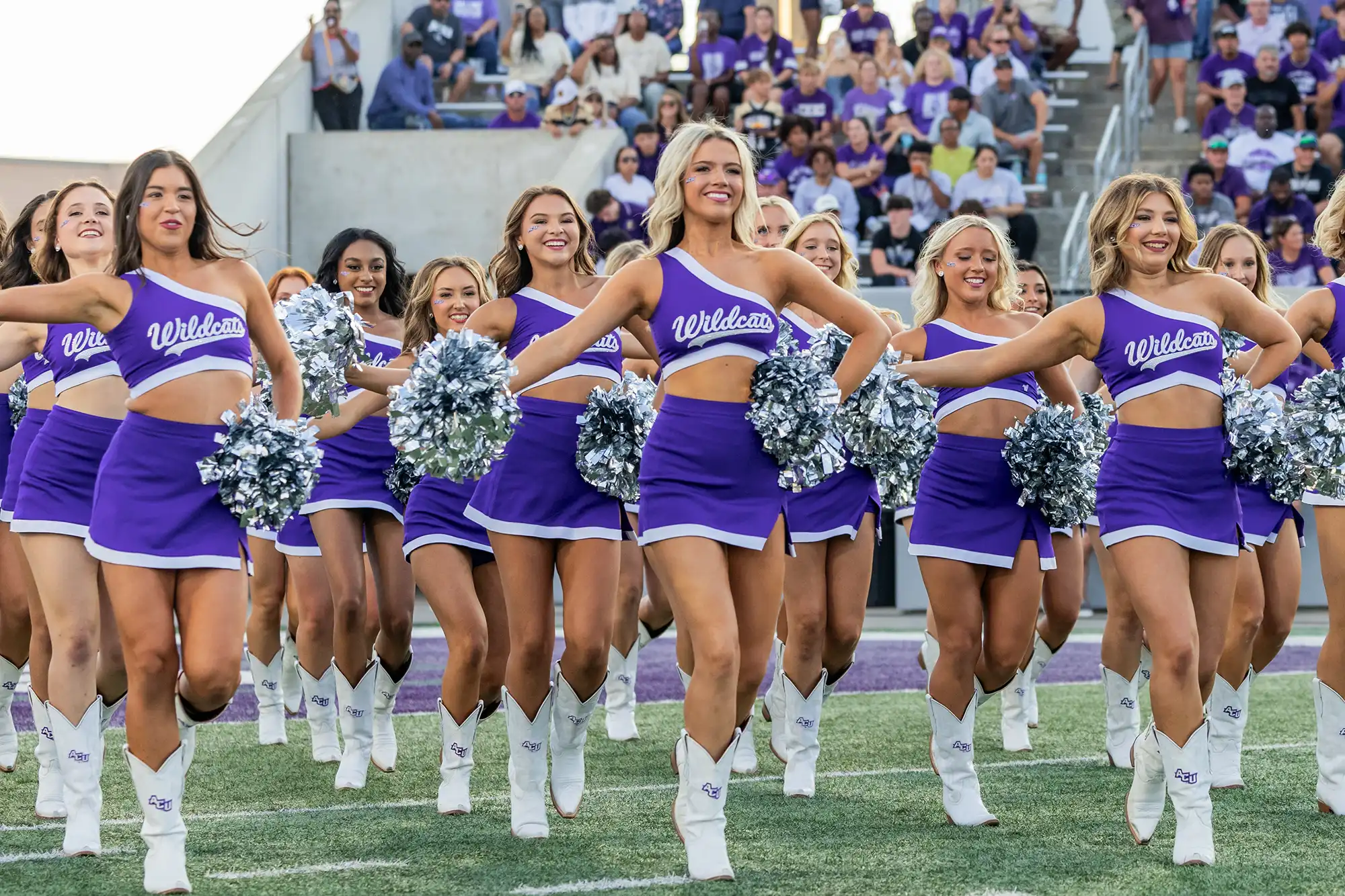 ACU Pom squad take the field at Wildcat Stadium before a game.