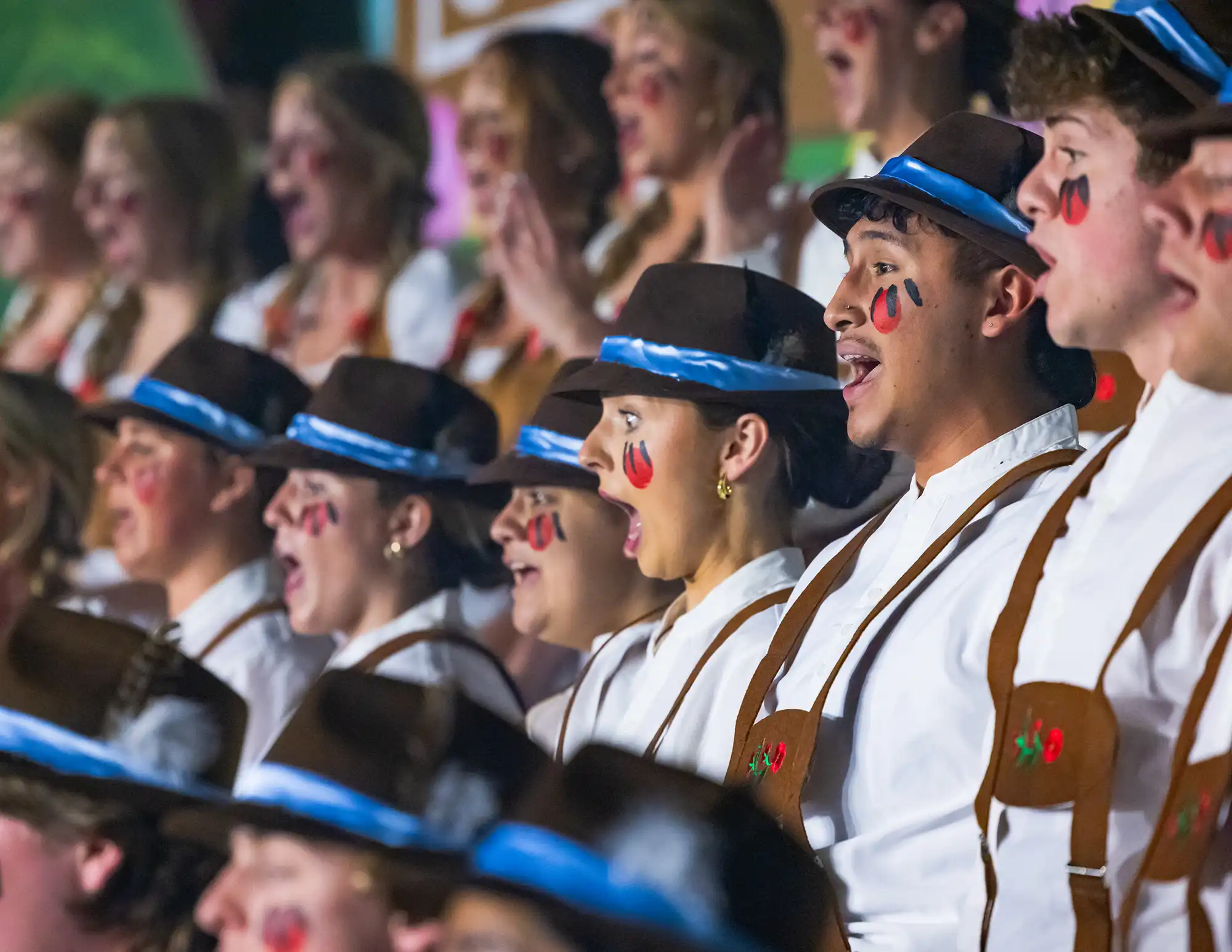 Students perform a class act during a Sing Song performance.