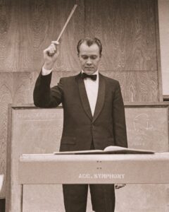 Dr. Ed George conducting