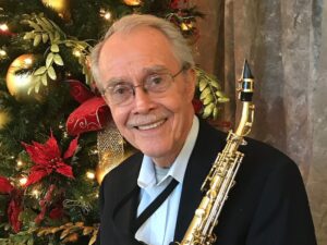 Dr. Ed George with a saxophone