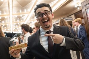 A student poses under the Paramount marquee