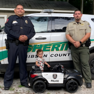Jesus Vargas with family in front of sheriff car