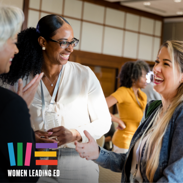 Women smiling and talking with each other