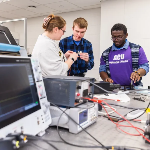 Members of the Engineering and Physics Club work on a project.
