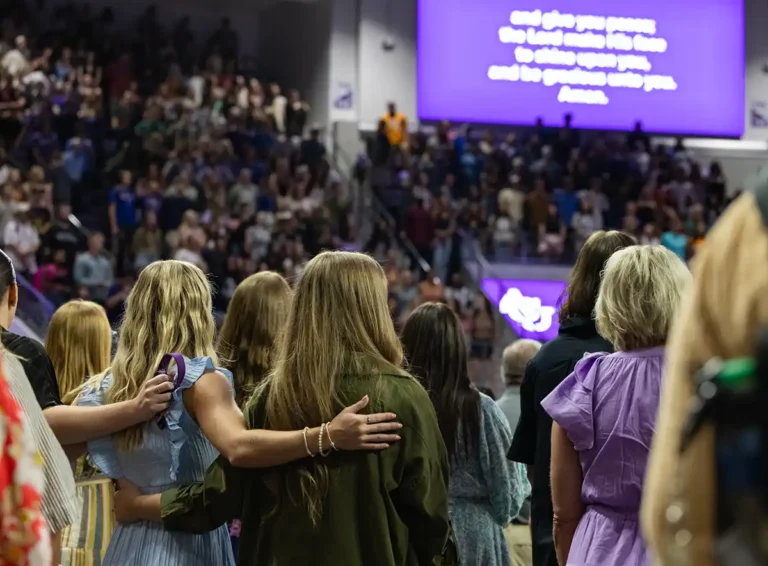 Crowd sings during Chapel in Moody Coliseum.