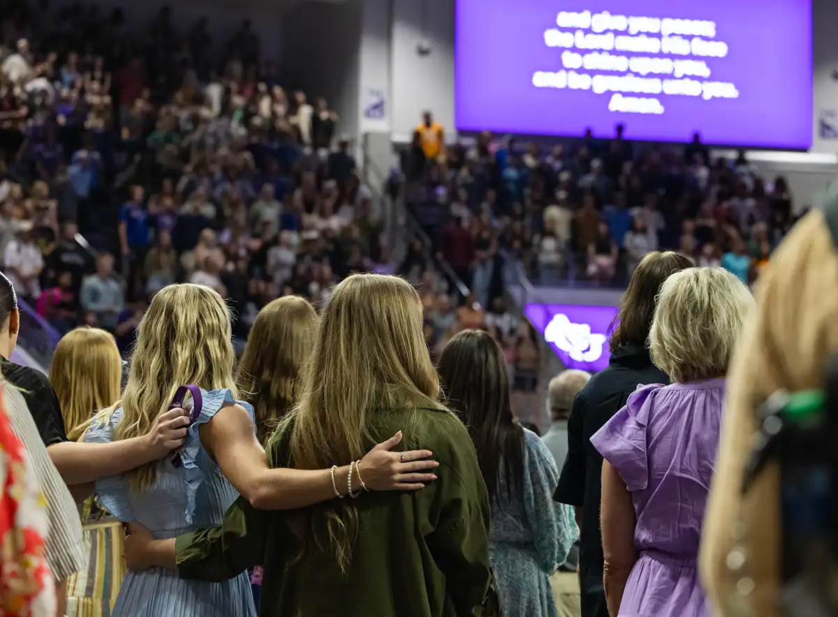 Crowd sings during Chapel in Moody Coliseum.