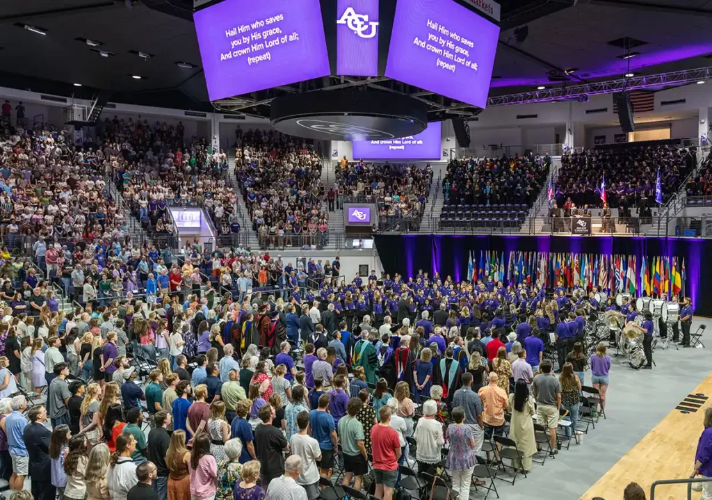 A crowd fills Moody Coliseum during Opening Assembly. 