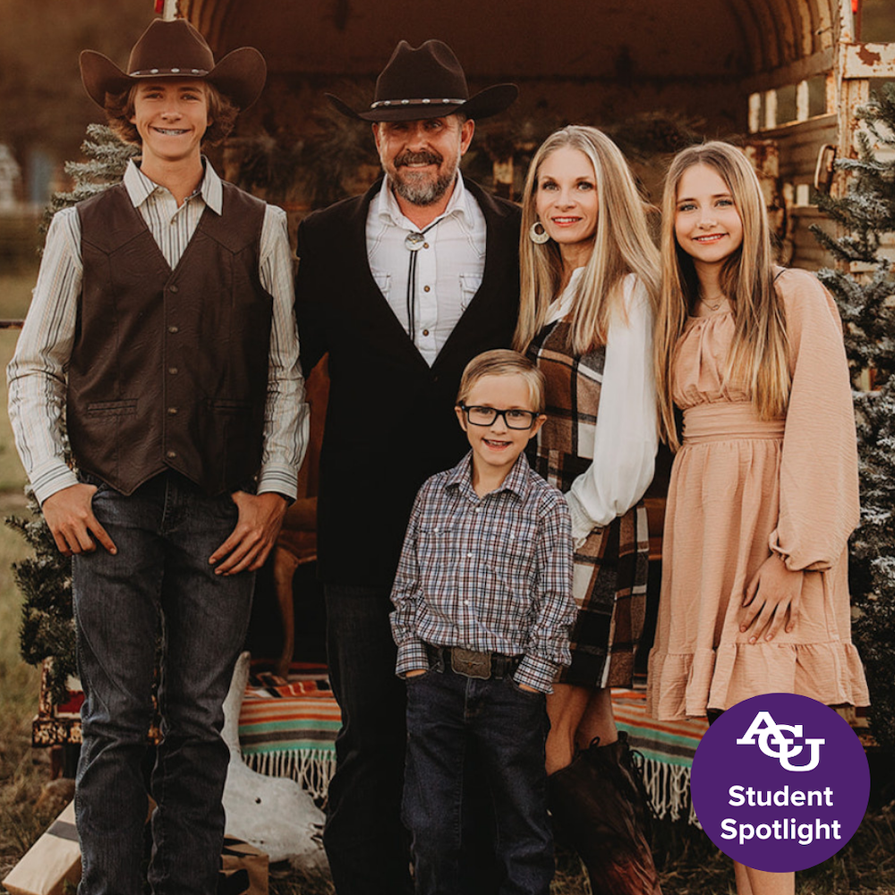 Brent Homan and family posing for family portrait.