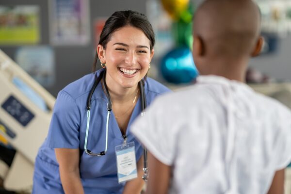 Nurse interacting with patient. 