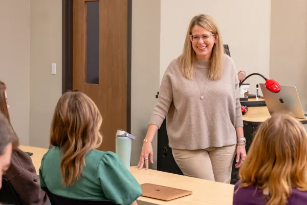 Jennifer Golden speaking with students during class.