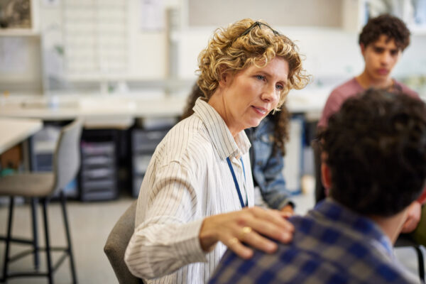 School psychologist helping student