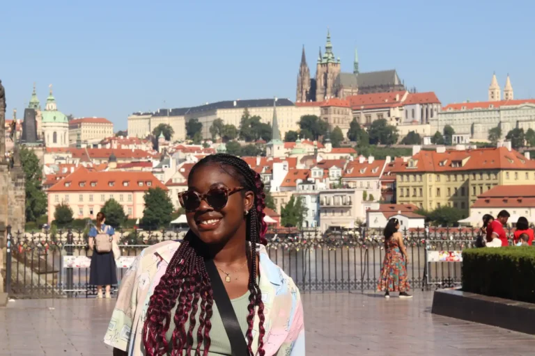 An ACU student poses by a scenic overlook during a trip with Study Abroad.